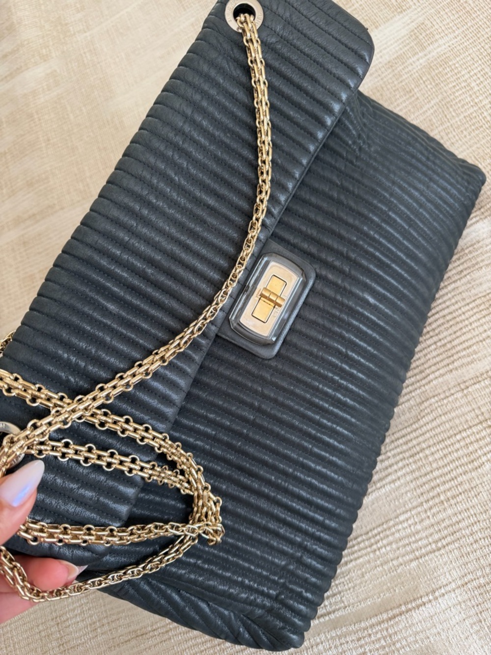 CHANEL Black Quilted Shoulder Bag with Gold Chain and Turn-Lock